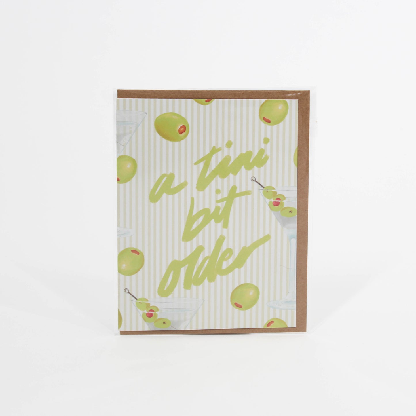 Striped card with olives on it saying "a tini bit older"