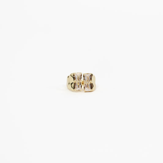 Gold baguette CZ signet ring with a clear gemstone on a white background