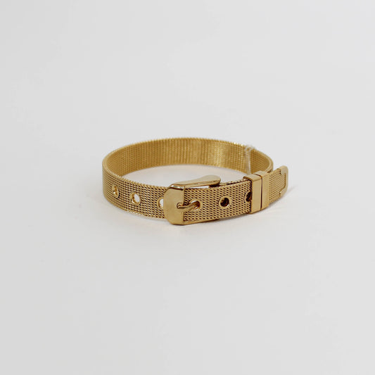 Gold metal belt bracelet on a white background