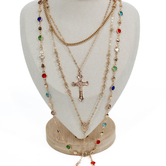 Boho Cross Layer Necklace with a cross pendant on a white mannequin bust