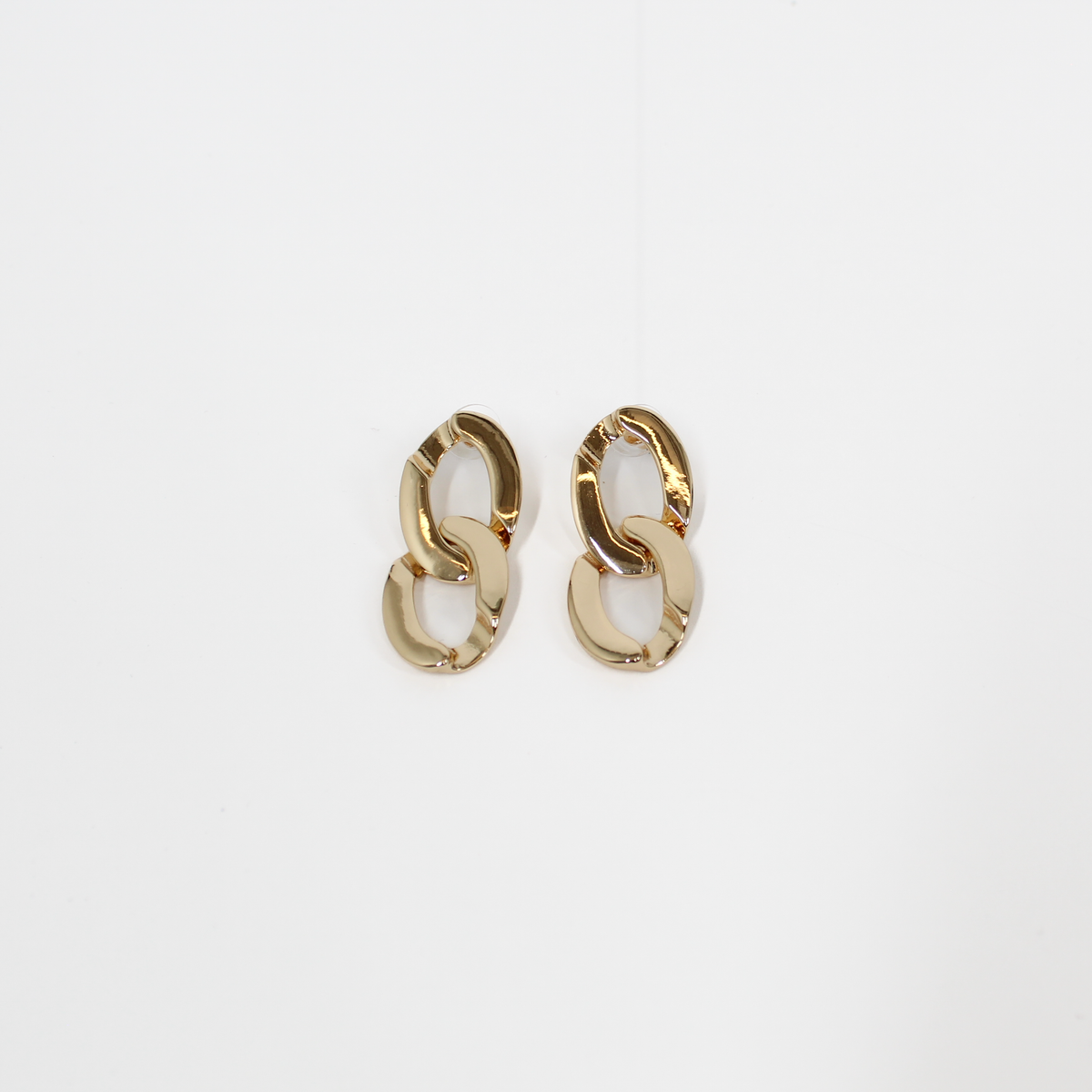 Gold chain-link drop earrings on a white background