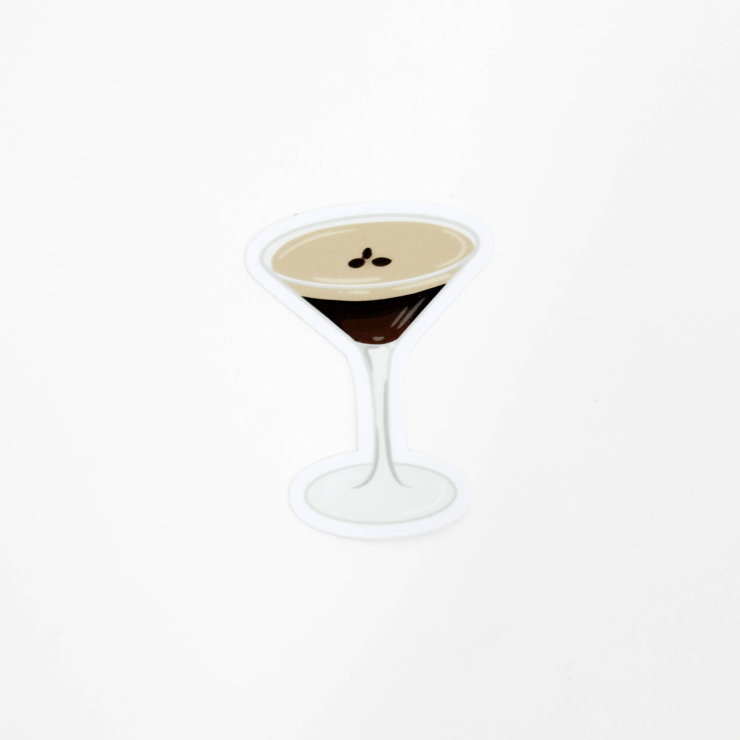 Cocktail in a martini glass with a white background