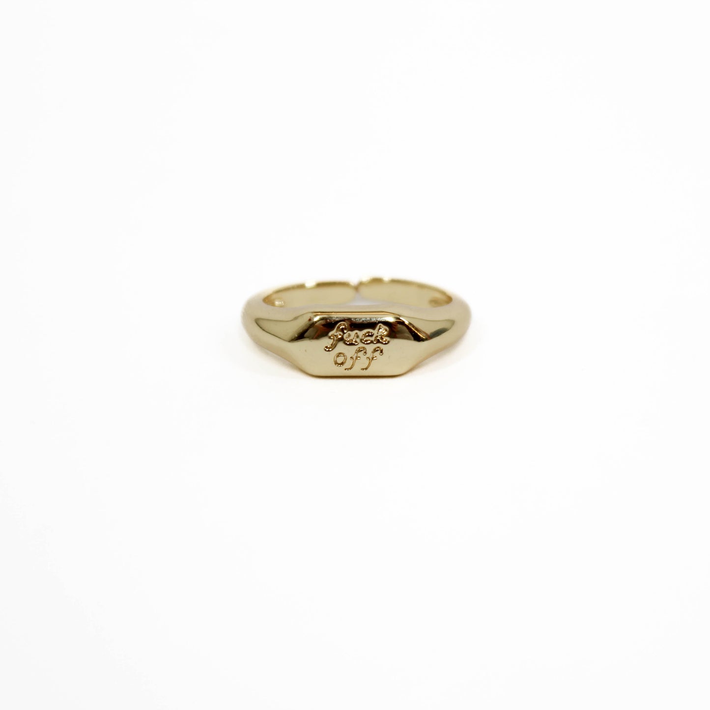 Gold ring with 'f**ck off' engraving on a white background