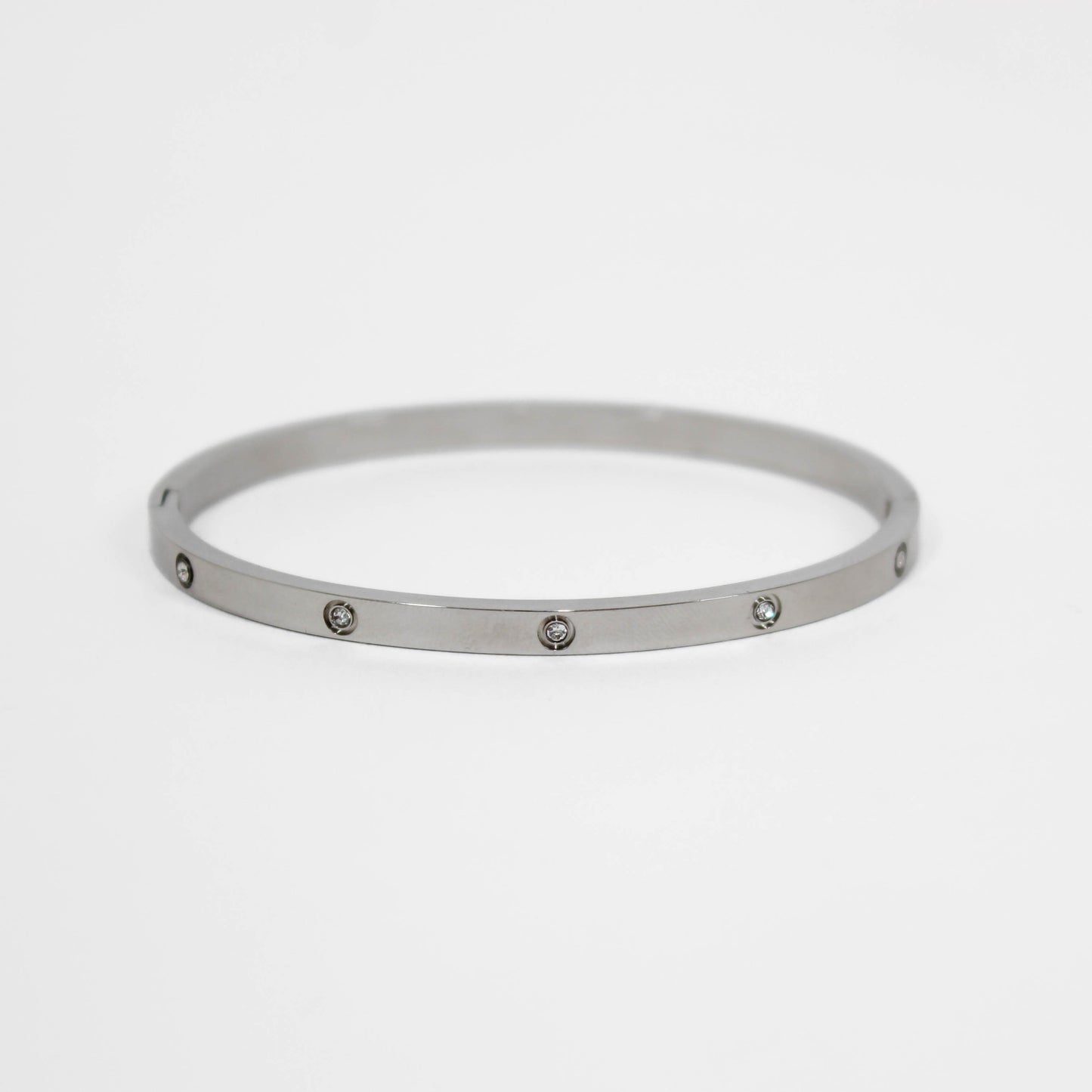 Silver bracelet with small stones on a white background