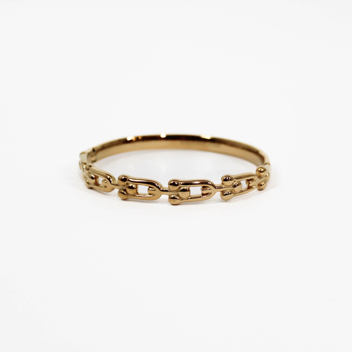 Gold chain-link industrial link hinged bangle bracelet ring on a white background
