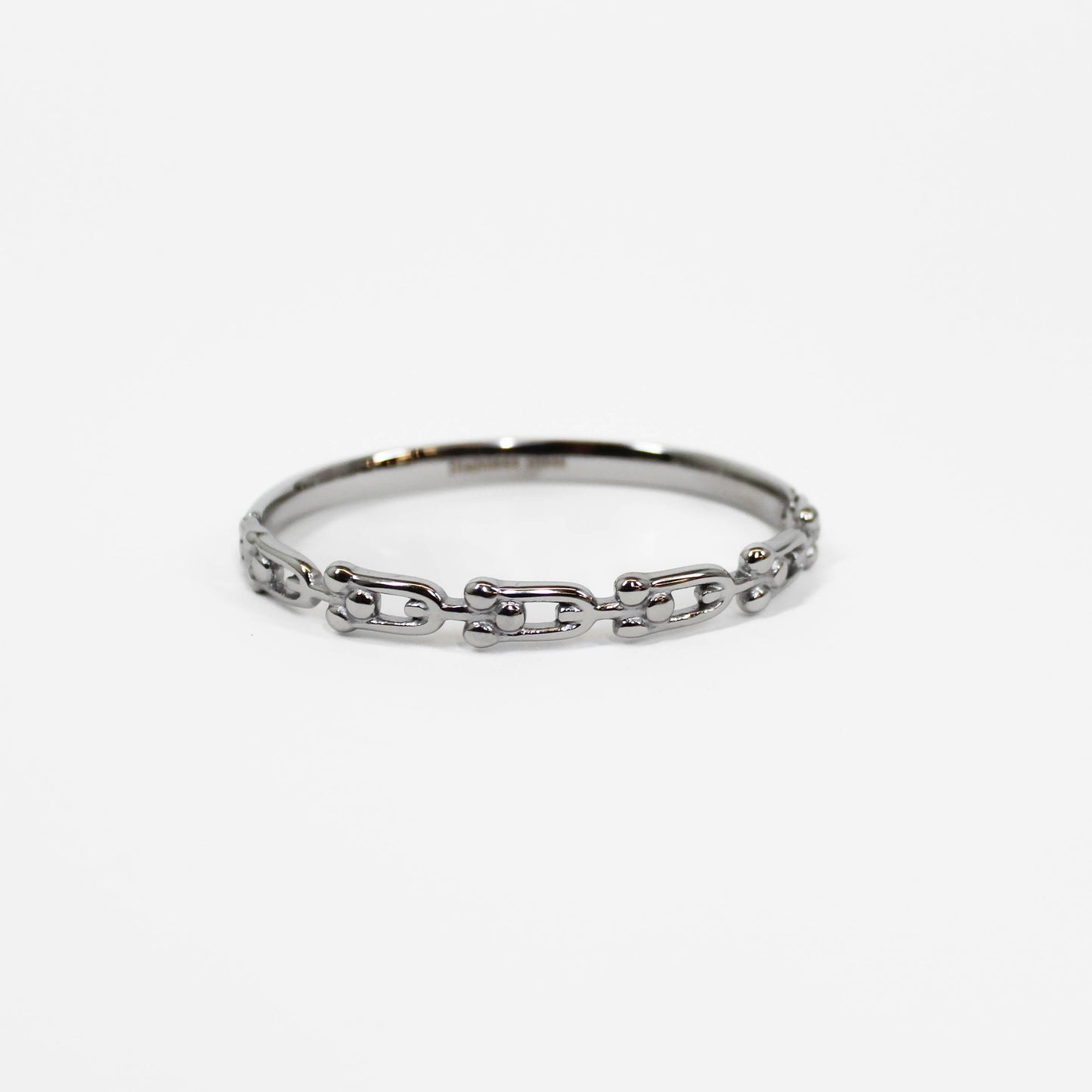 Silver chain industrial link hinged bangle bracelet on a white background