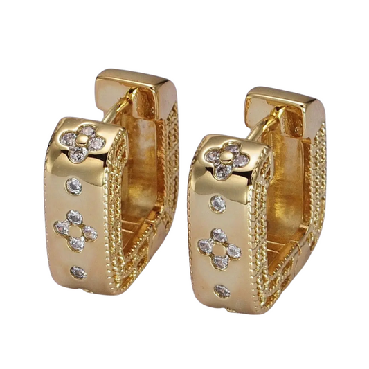 Gold hoop earrings with diamond accents on a white background