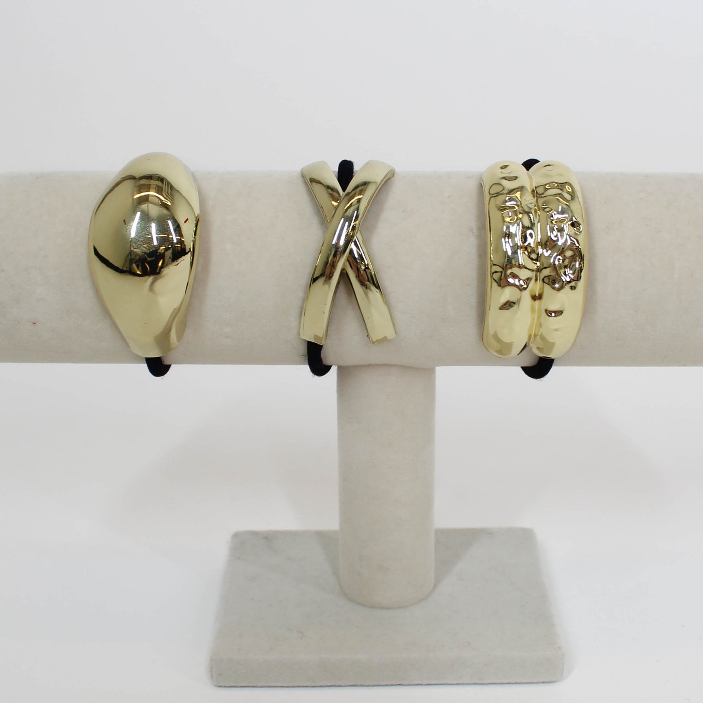 black hair ties with gold details