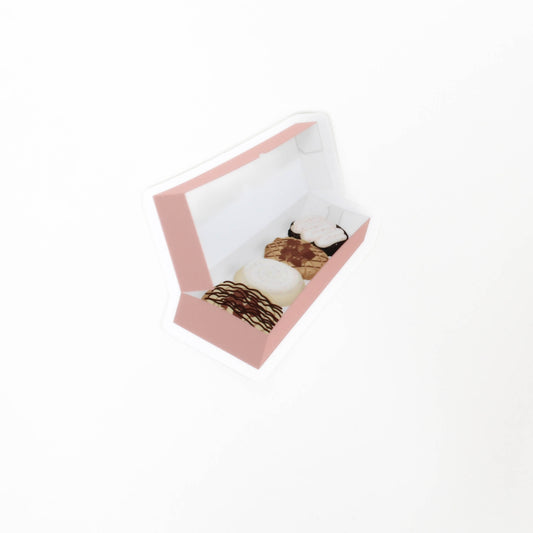 Pink box with cookies in it.
