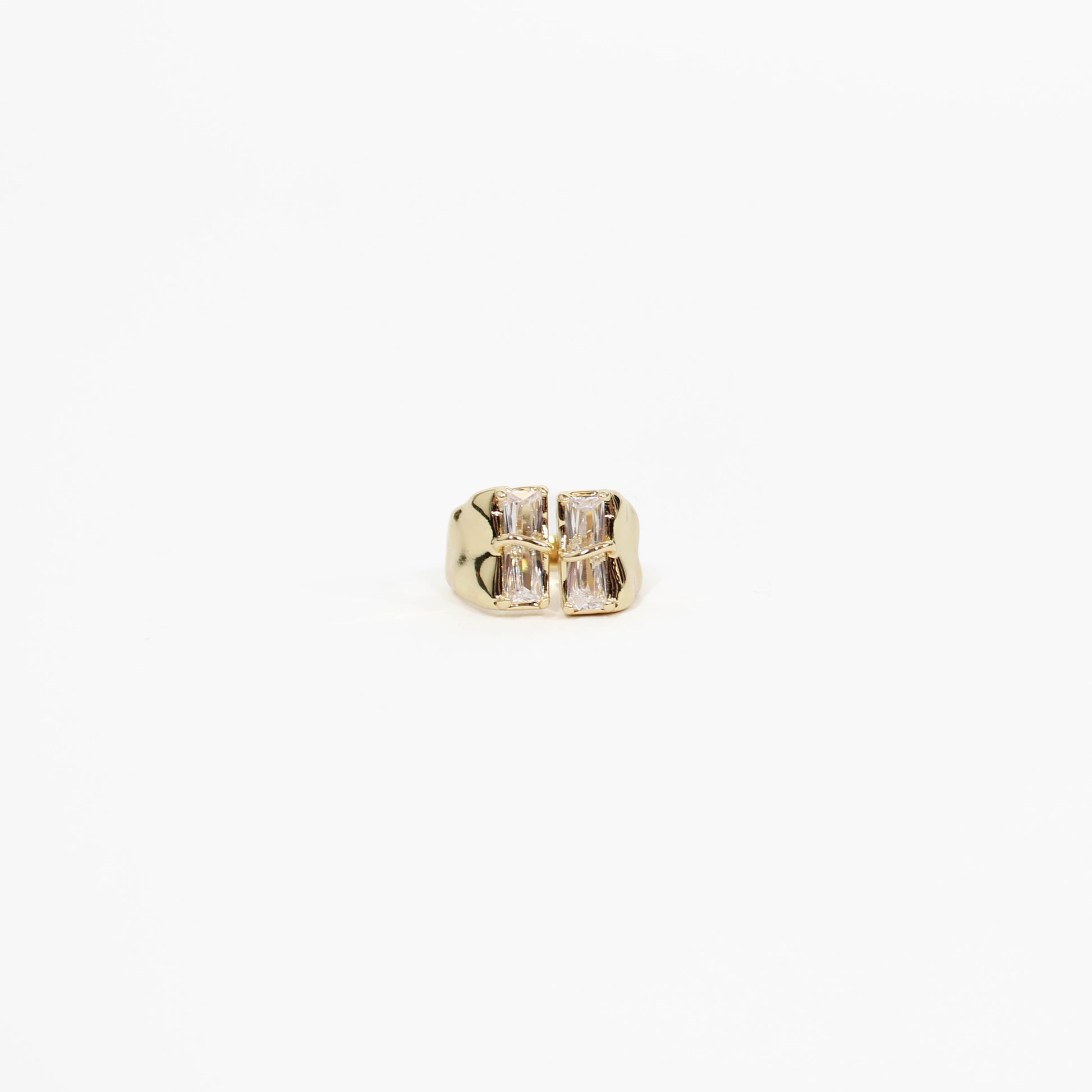 Gold baguette CZ signet ring with a clear gemstone on a white background