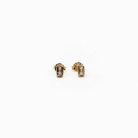 Gold baguette stud earrings with gemstones on a white background