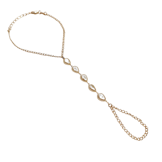 Gold pearl hand chain on a white background. 