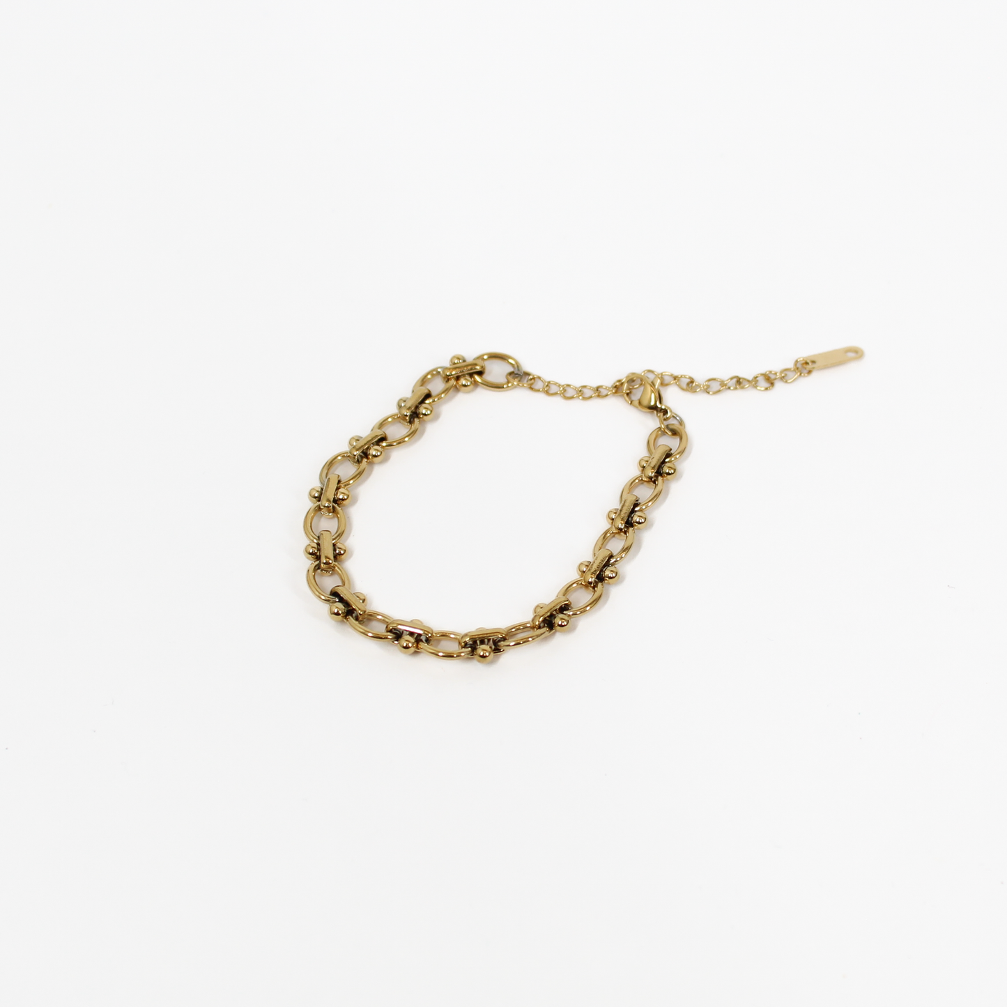 Gold beaded link chain bracelet on a white background