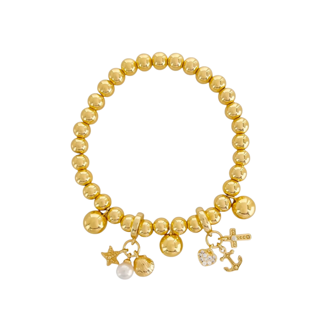 Gold beaded bracelet with nautical charms on a white background
