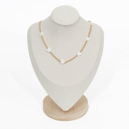 beaded pearl icon Necklace with heart-shaped pendants on a white mannequin bust