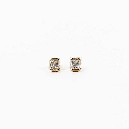 Pair of gold bezel stud earrings with gemstones on a white background