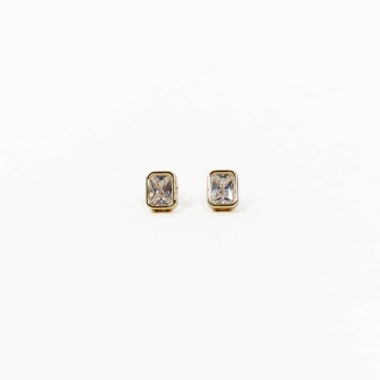 Pair of gold bezel stud earrings with gemstones on a white background