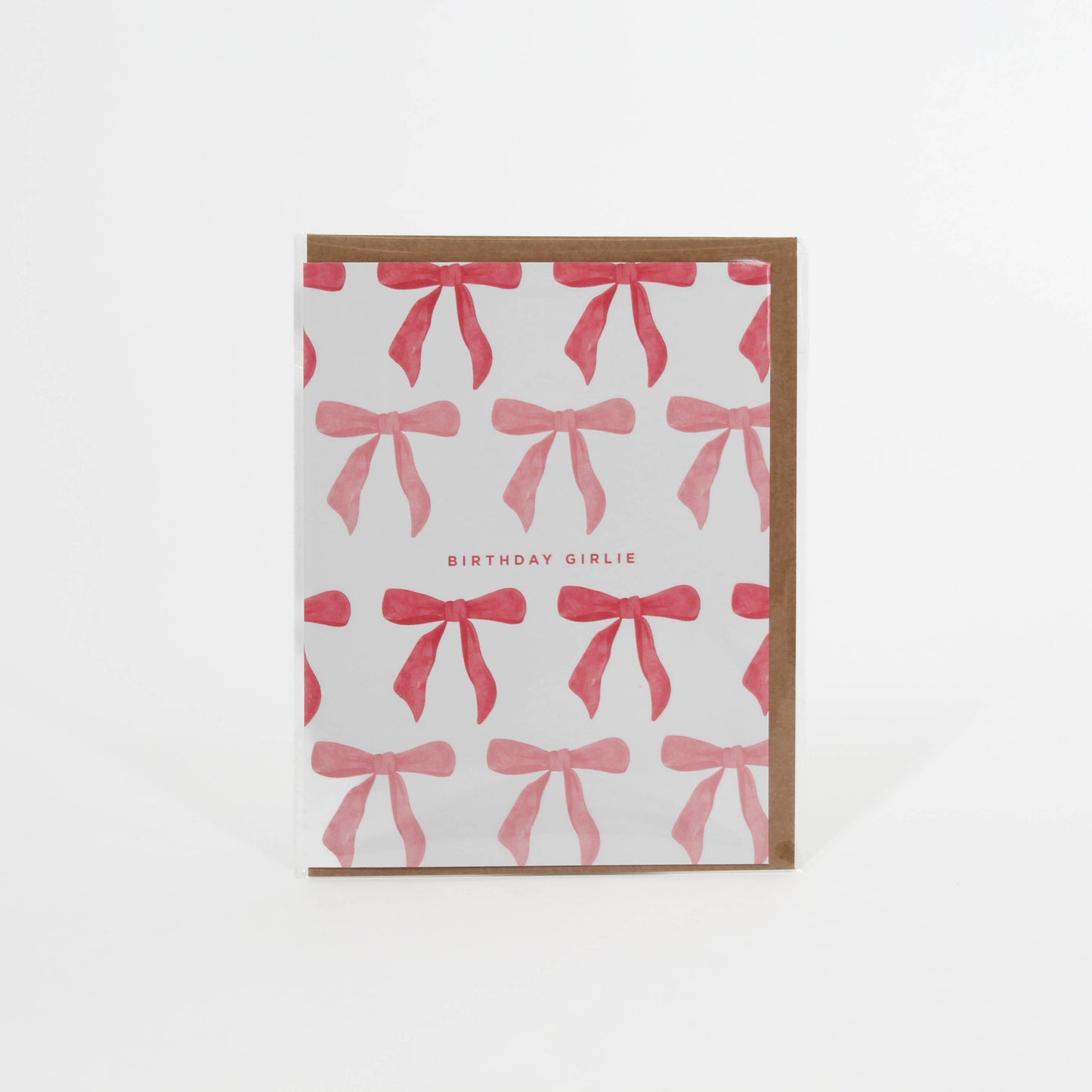 Card tat says 'Birthday Girlie' with different color pink bows surrounding it 