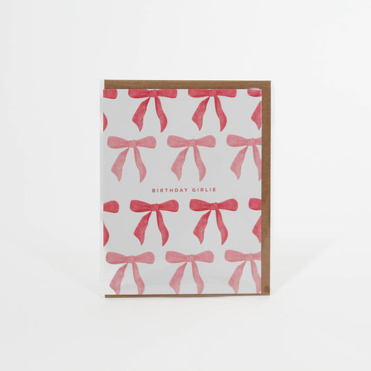 Card tat says 'Birthday Girlie' with different color pink bows surrounding it 