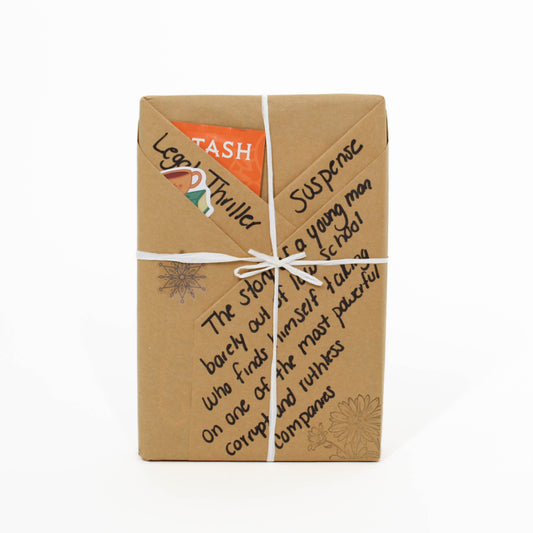 Book wrapped in brown paper with text and a logo on a white background