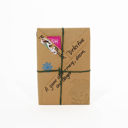 Brown paper book with decorative elements on a white background