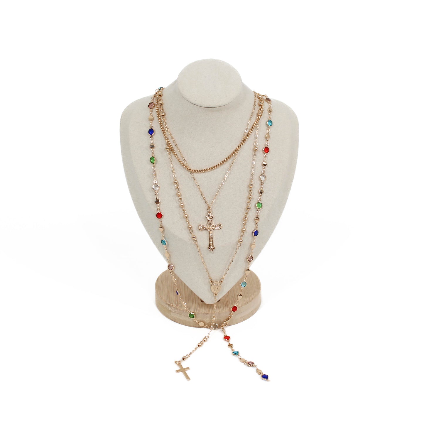 Boho cross layer Necklace with colorful beads and a cross on a mannequin bust against a white background