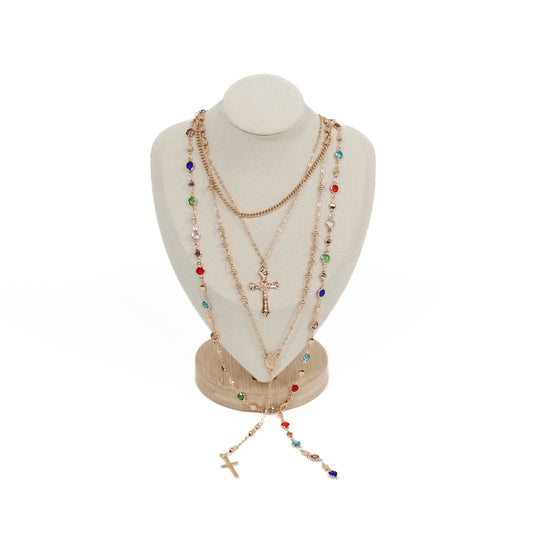 Boho cross layer Necklace with colorful beads and a cross on a mannequin bust against a white background