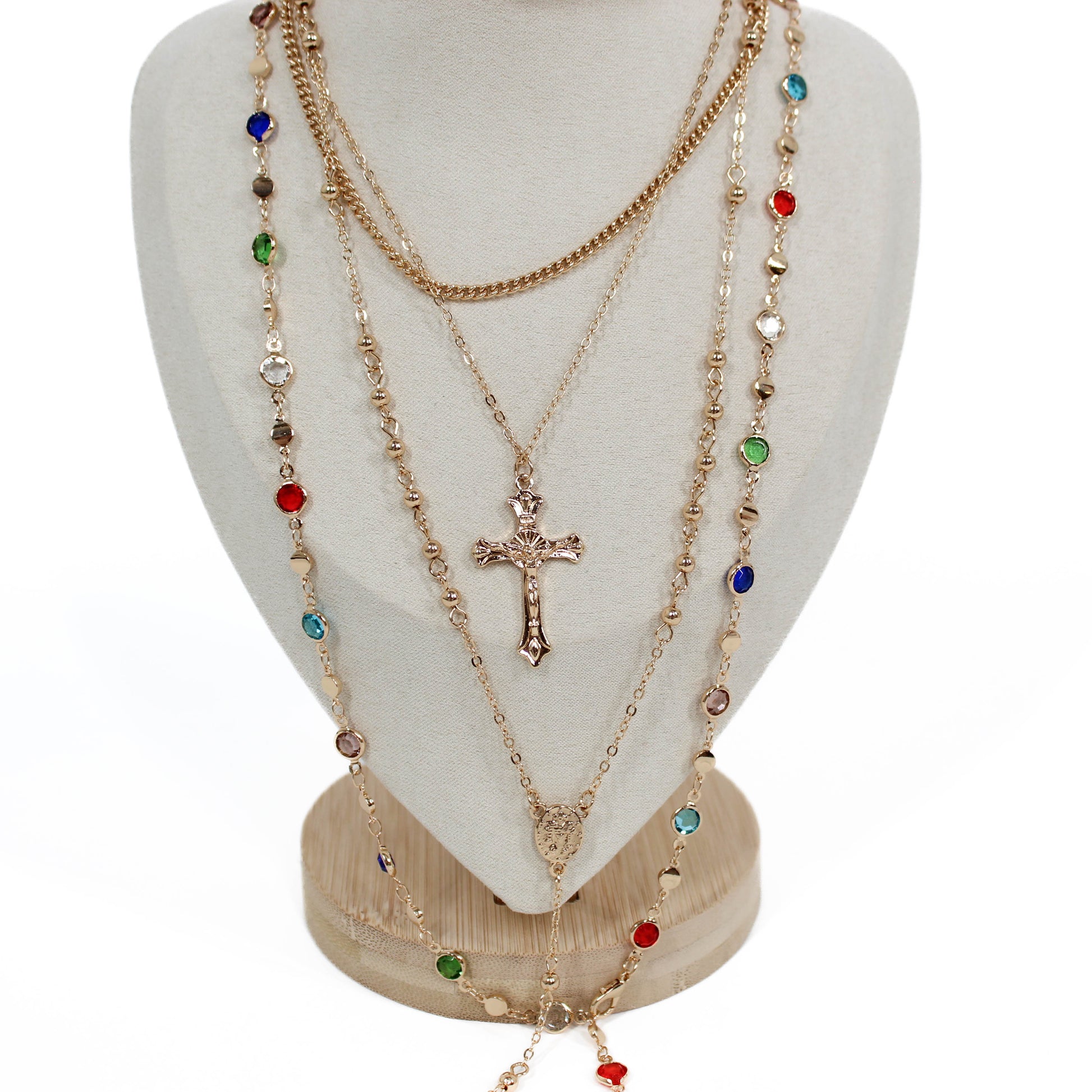 Boho Cross Layer Necklace with a cross pendant on a white mannequin bust