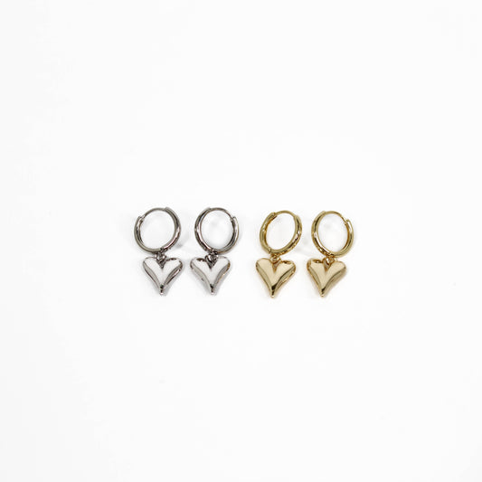 Two pairs of heart-shaped bubble heart huggie earrings, one silver and one gold, on a white background.