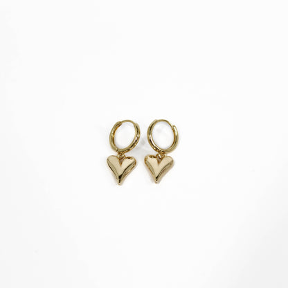 Gold heart-shaped bubble heart huggies earrings on a white background
