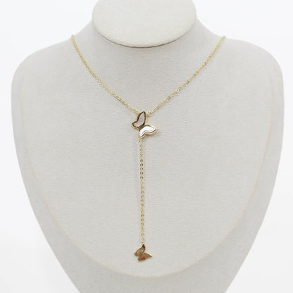 Butterfly lariat necklace on a mannequin with a white background 