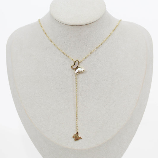 Butterfly lariat necklace on a mannequin with a white background 