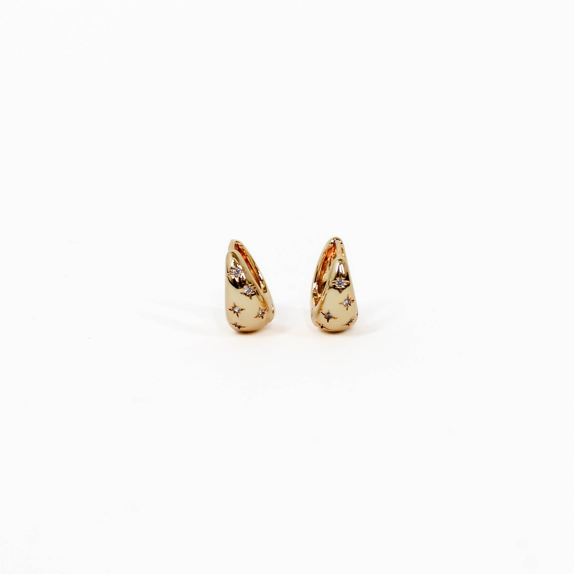 Gold teardrop-shaped celestial star dome earrings on a white background
