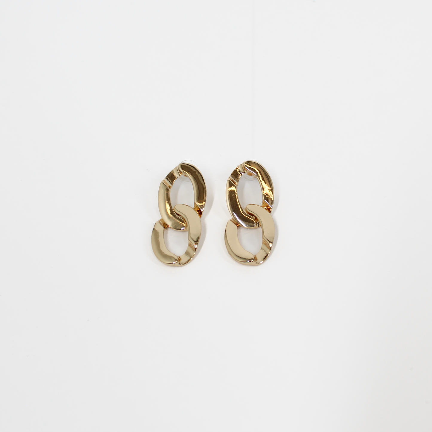 Gold chain-link drop earrings on a white background