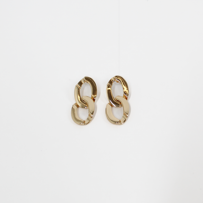 Gold chain-link drop earrings on a white background