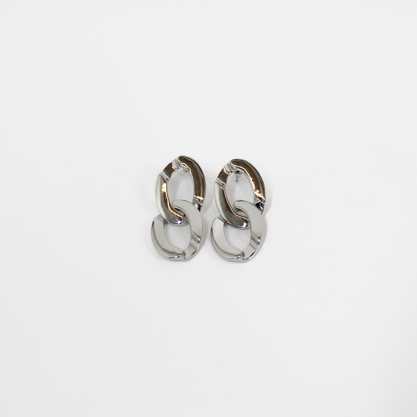 Pair of silver chain link drop earrings on a white background