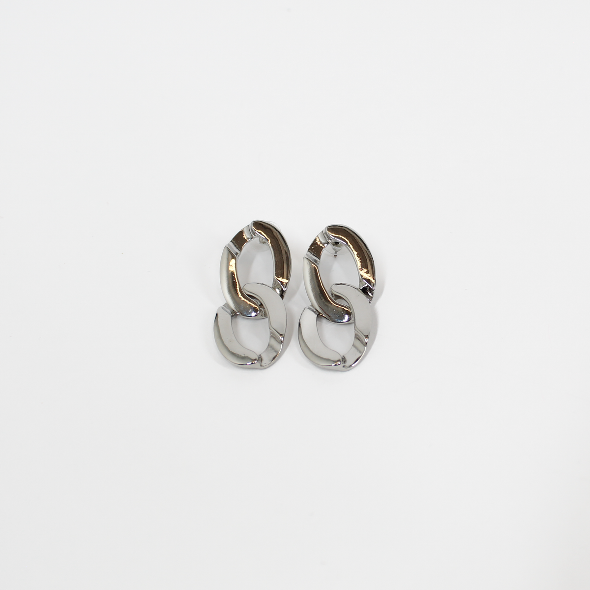 Pair of silver chain link drop earrings on a white background
