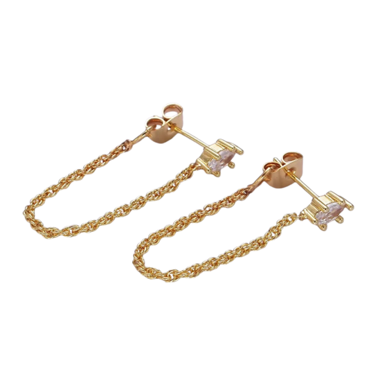 Gold chain earrings with clear gemstones on a white background