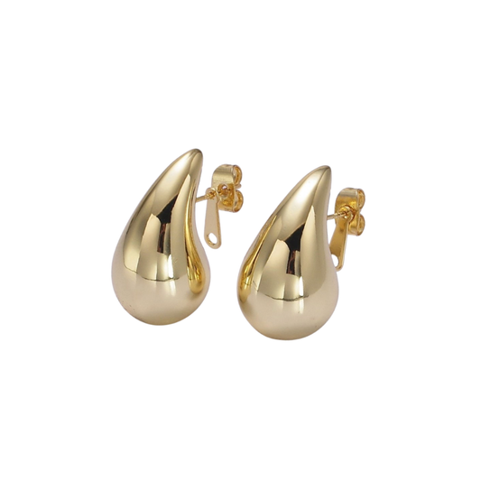 Gold chunky teardrop earrings on a white background