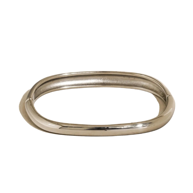 close up of silver bangle on white background