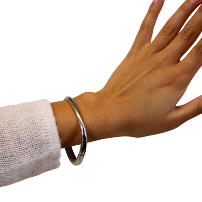 silver bangle on hand model