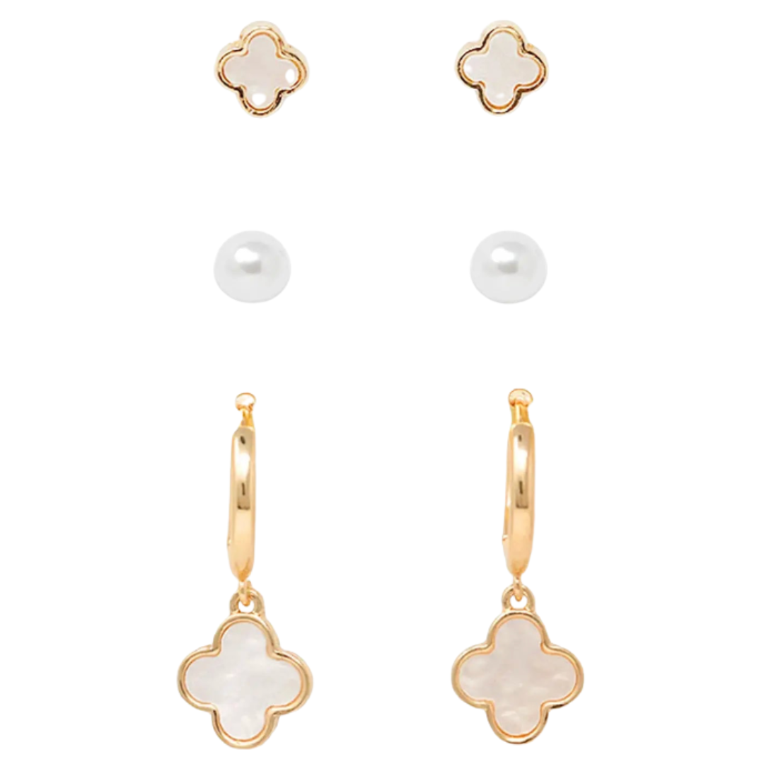 Gold and white clover-shaped earrings on a white background