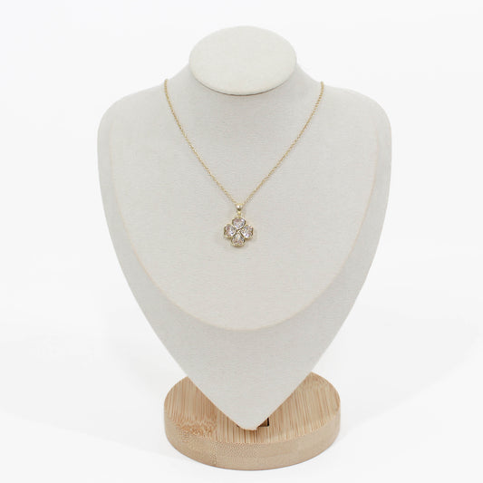 Crystal Clover Necklace on a gold chain on a mannequin with a white background