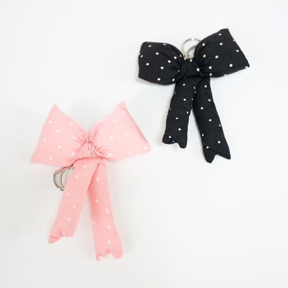 pink polka dot bow keychain and black polka dot bow keychain