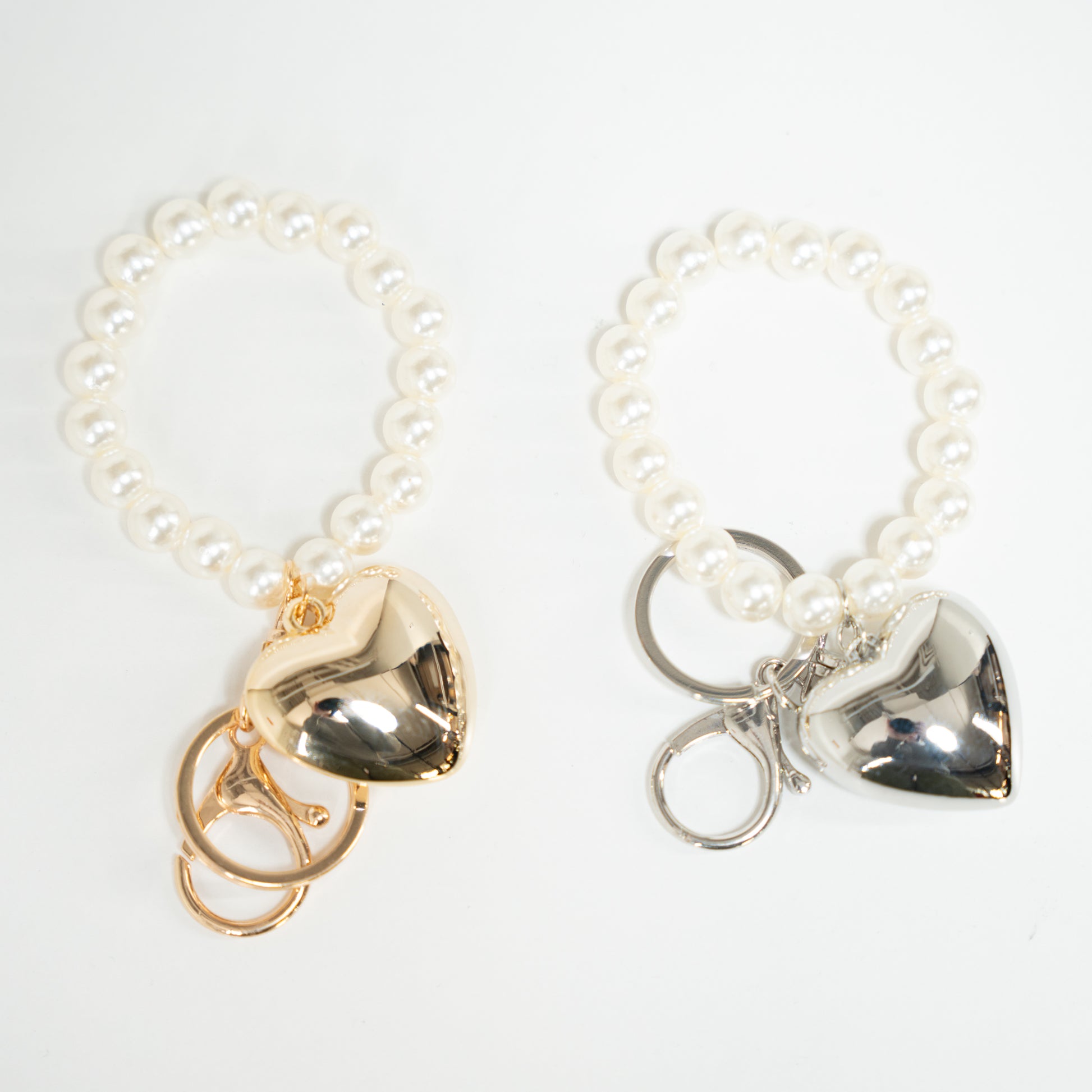 gold heart pearl keychain and silver heart keychain