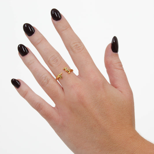 Dachshund Band RIng Gołd on hand on white background 