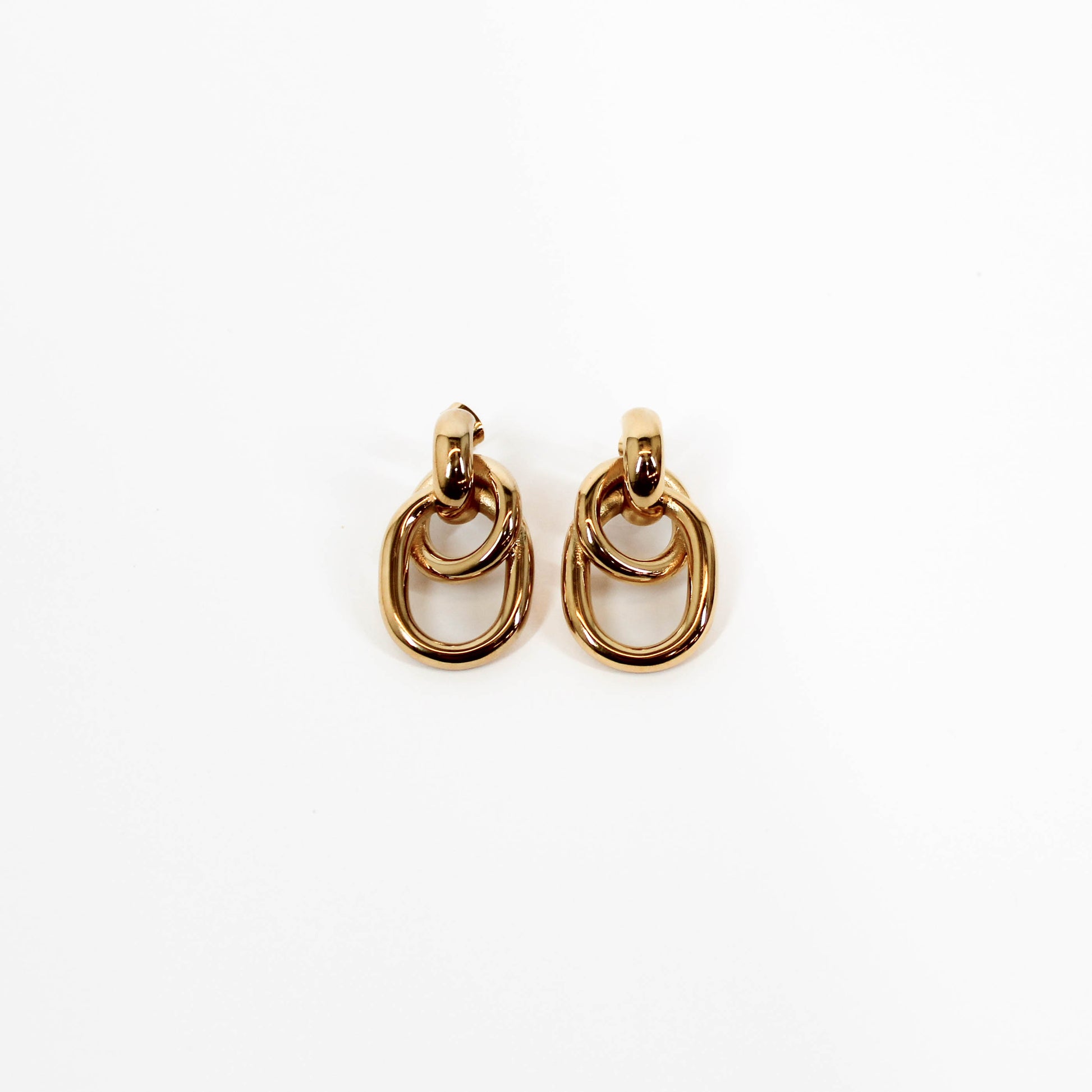 Double link drop earrings on a white background