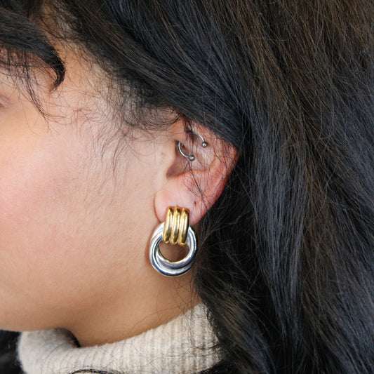 Dual-Tone Hoop Earringson model