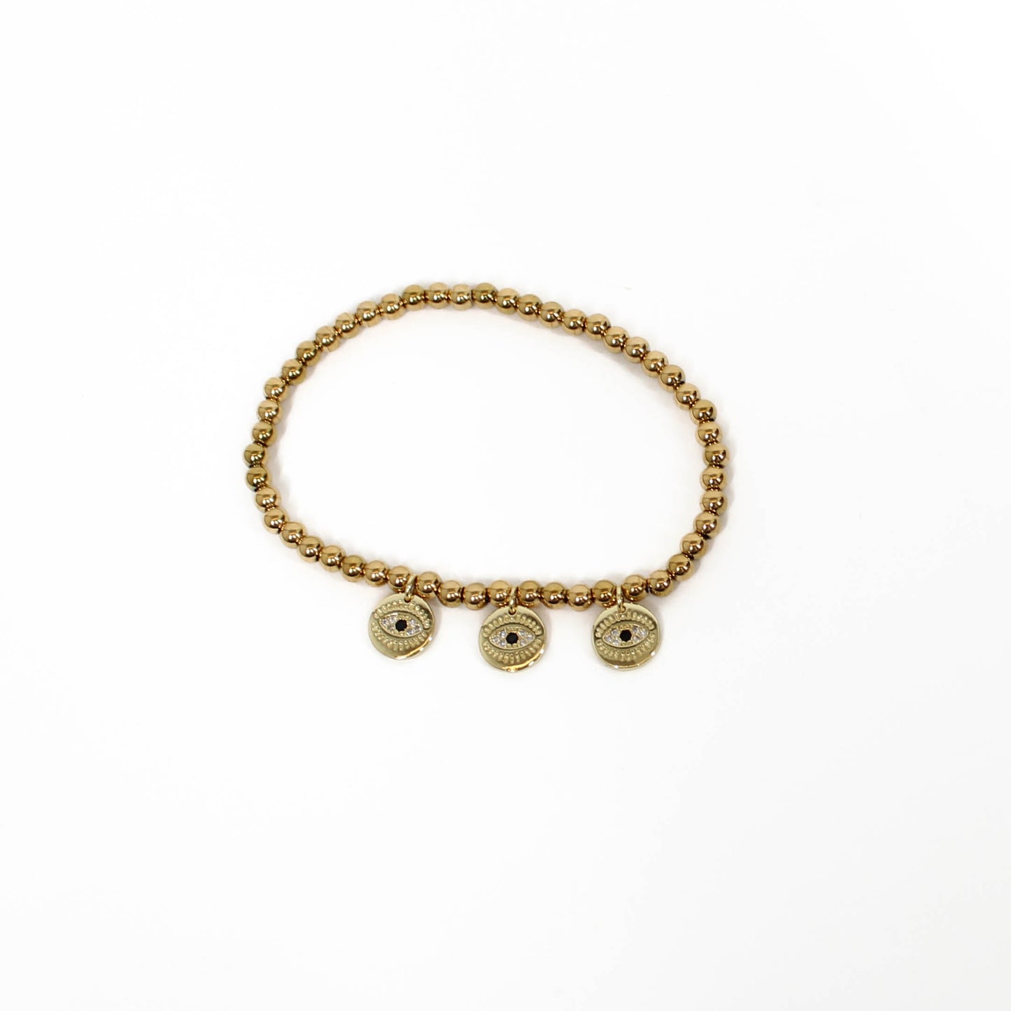 Gold beaded bracelet with three evil eye-shaped charms on a white background