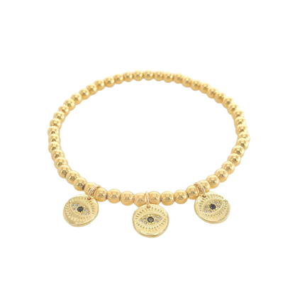 Gold beaded bracelet with circular evil eye charms on a white background